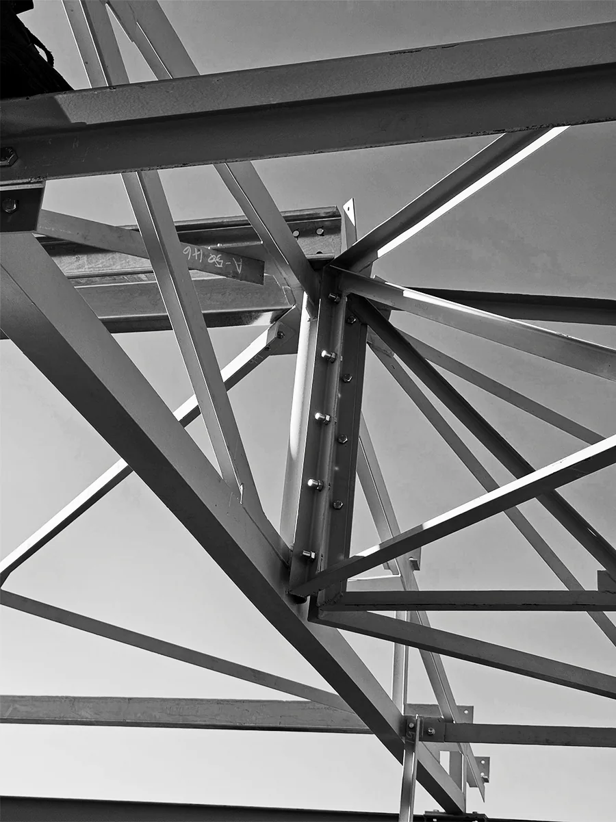 Greyscale close view of structural-steel members and bolted connections
